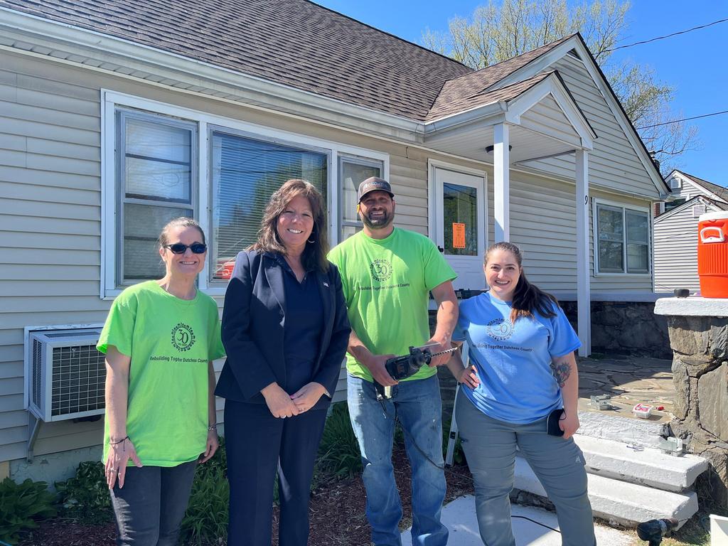 Senator Sue Serino with GKontos Roofing volunteers.