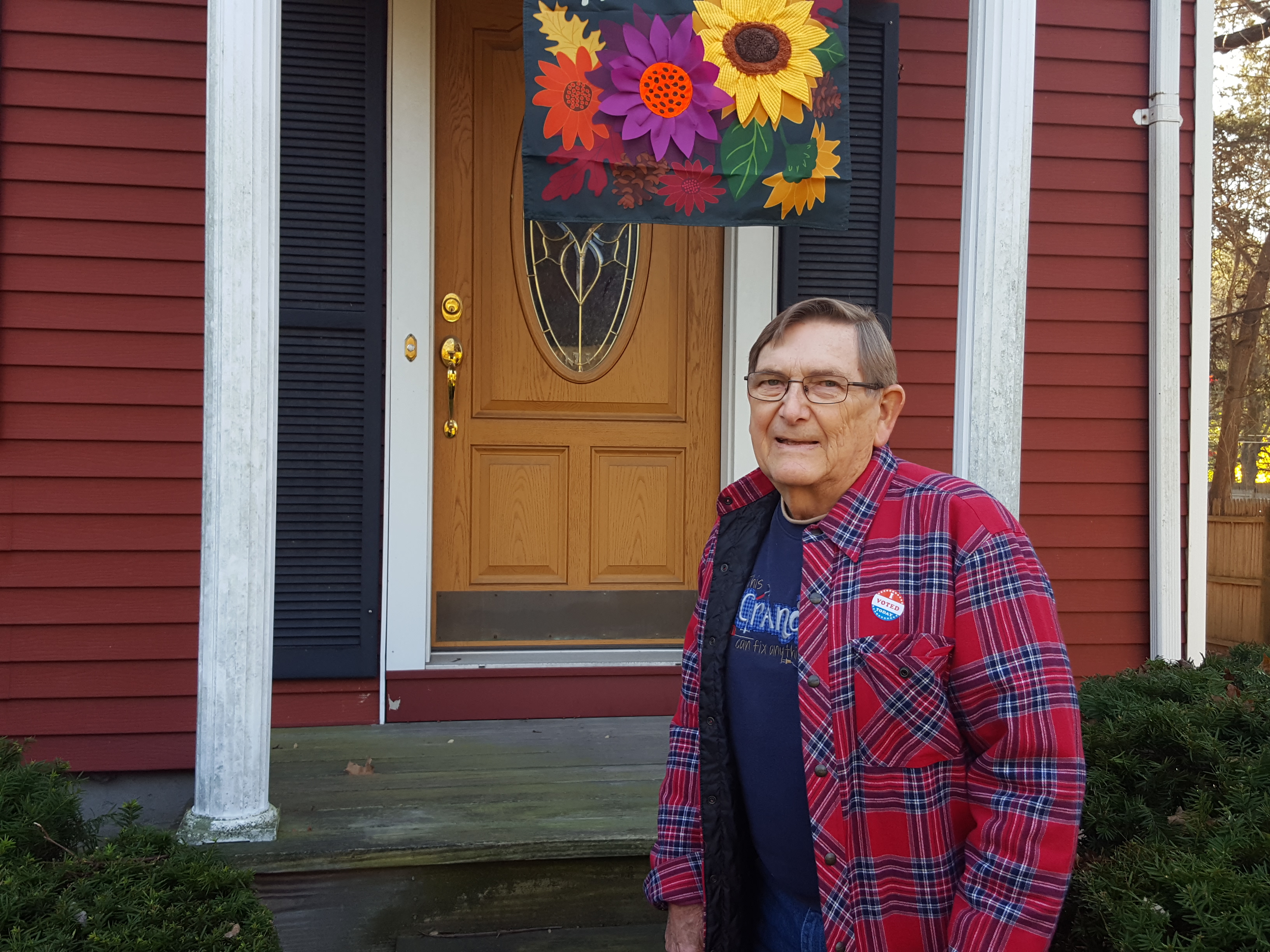 Bill in front of his front door.