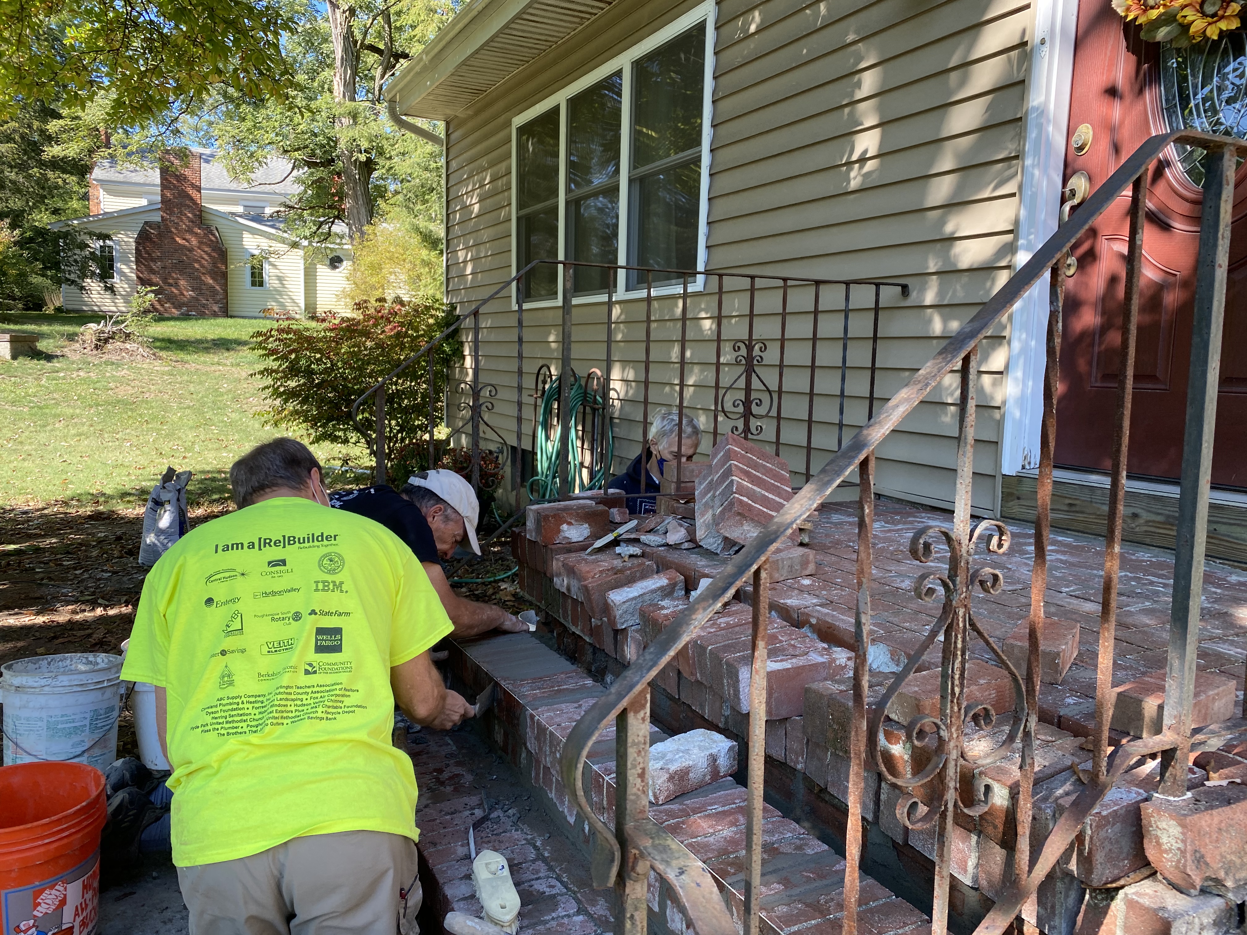 UMCHP volunteers repairing the front steps