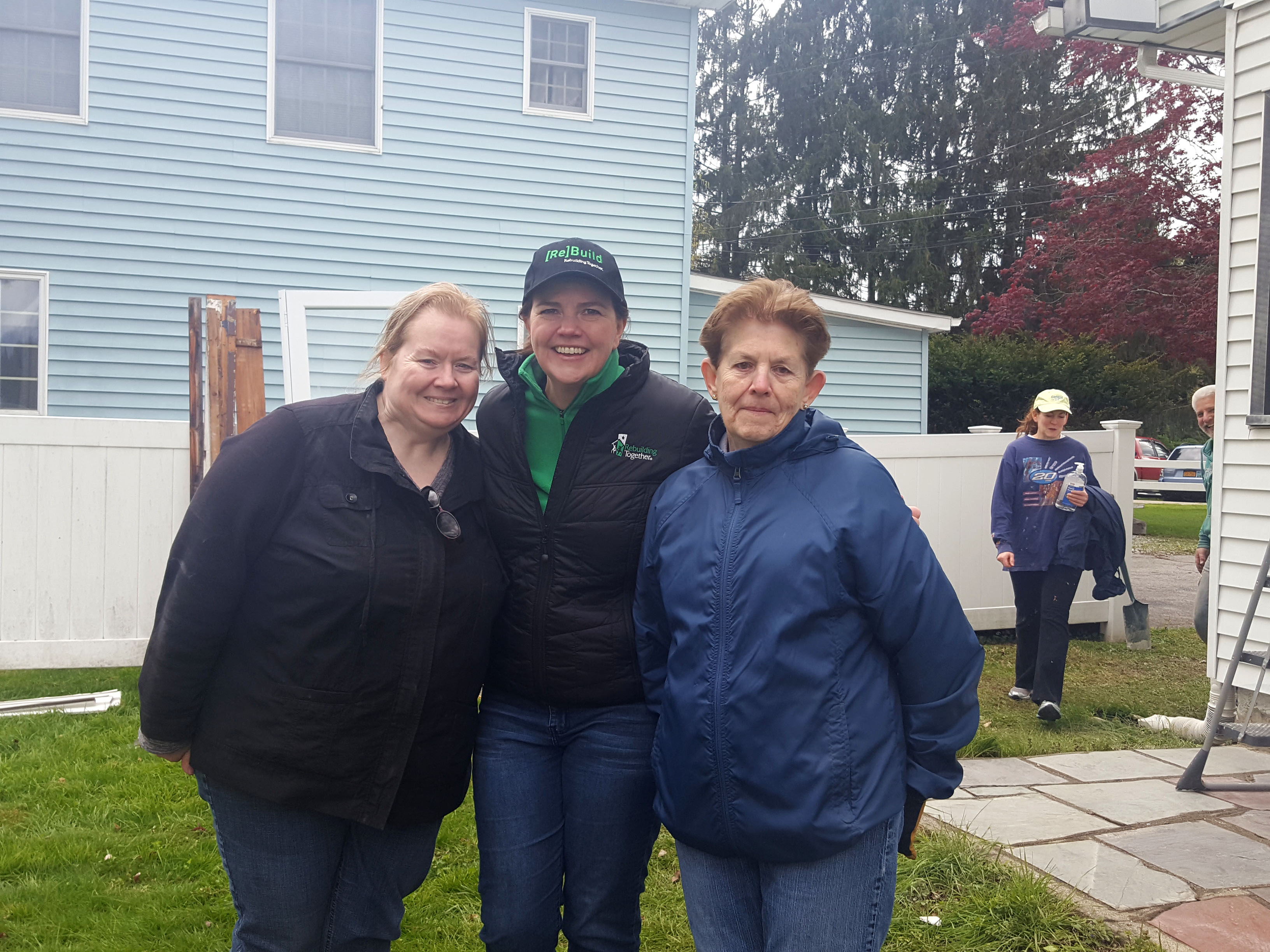 Homeowners AnnMarie and Lee Baker with Christina Boryk, Executive Director of RTDC