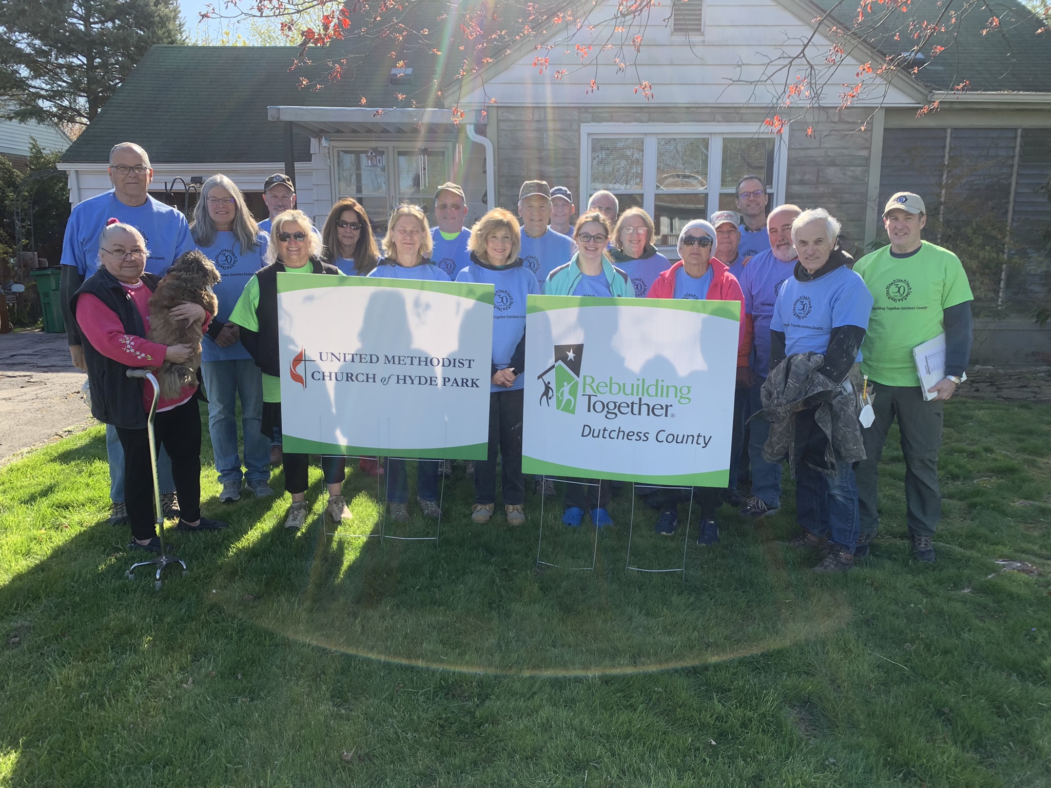 United Methodist of Hyde Park pose alongside homeowner and RTDutchess.