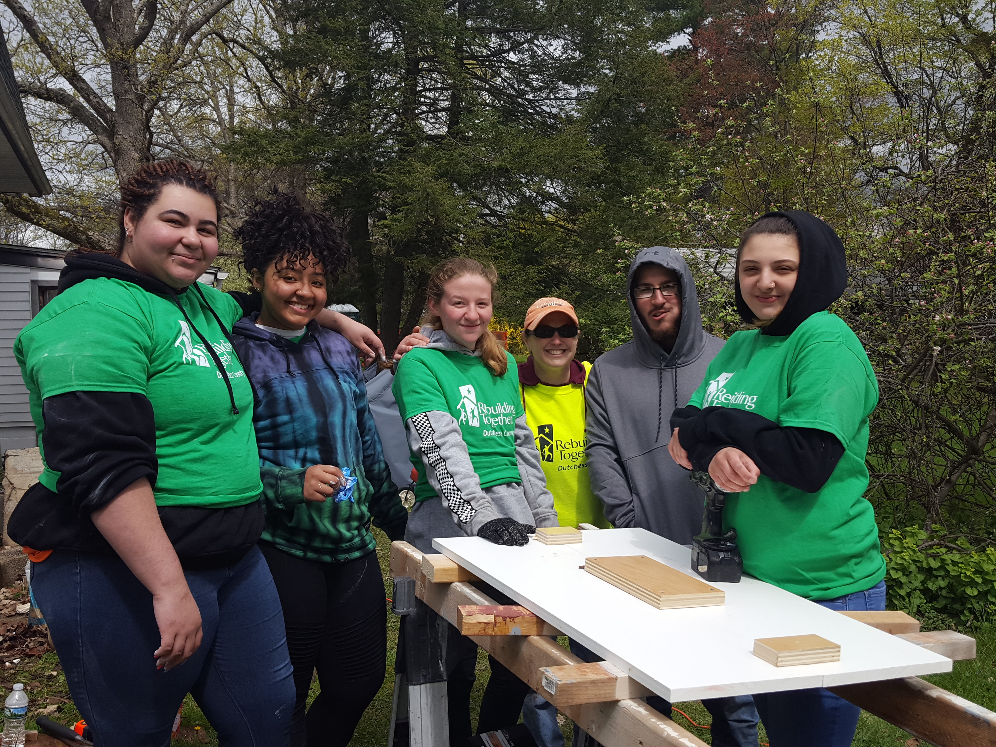 Volunteer Coordinator, Laura, with volunteer high school students.