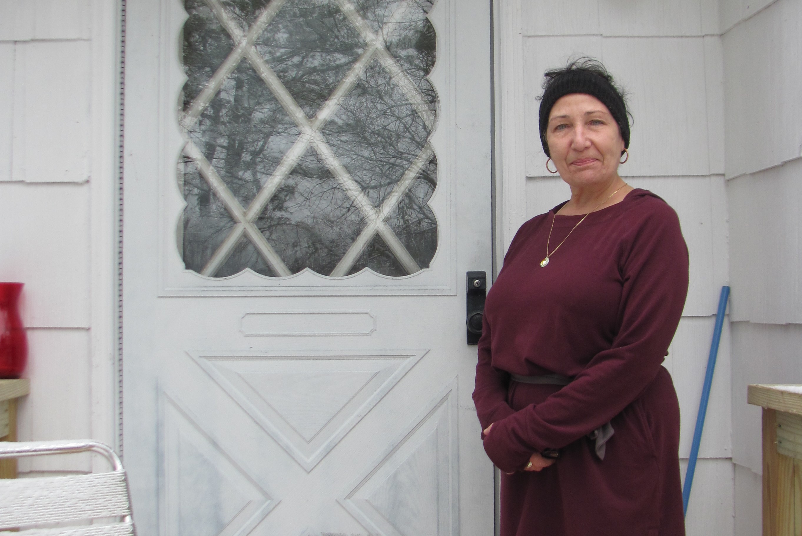 Homeowner Michele in front of her front door.