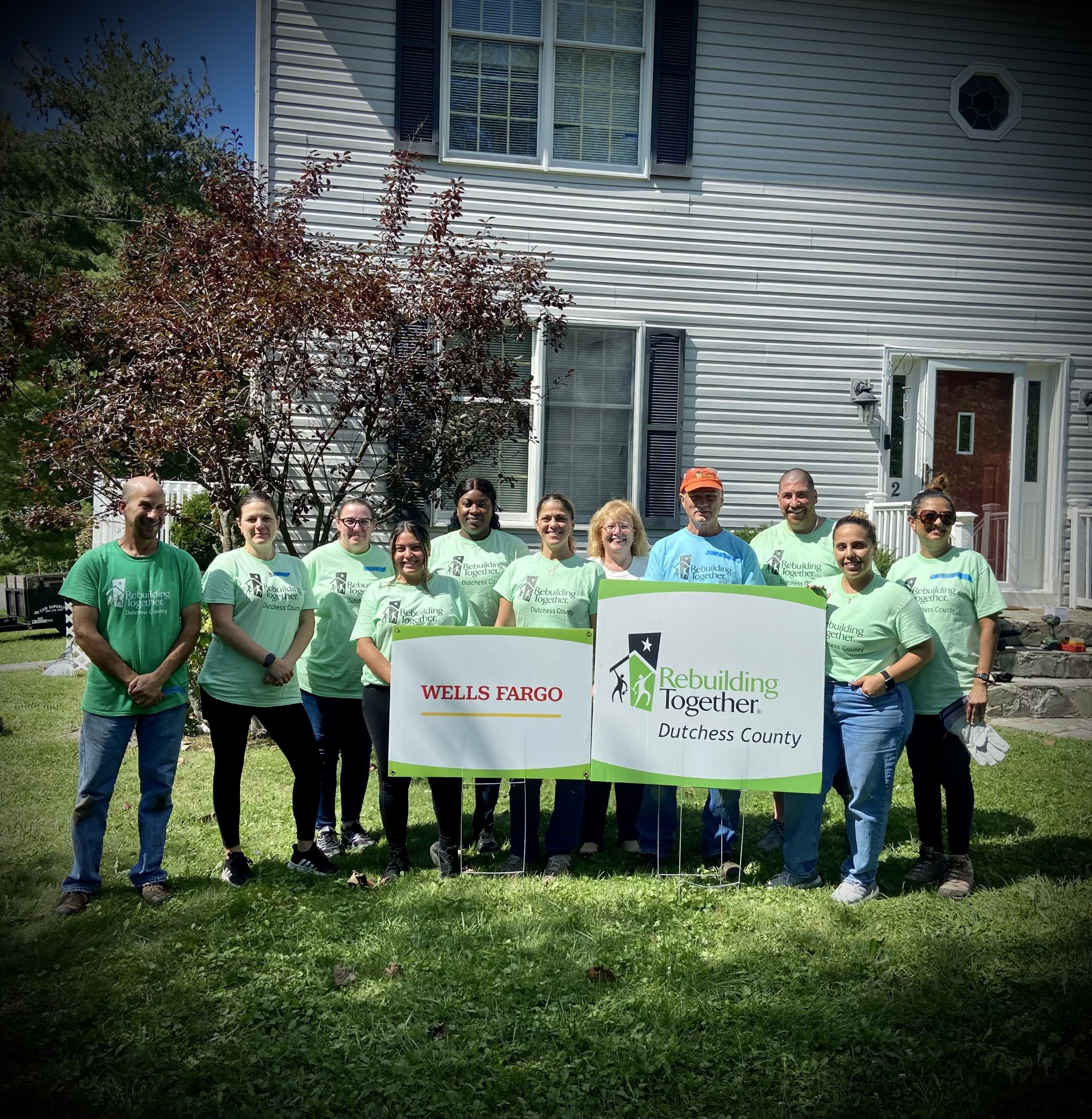 Wells Fargo Team poses with Rebuilding Together at project day event.