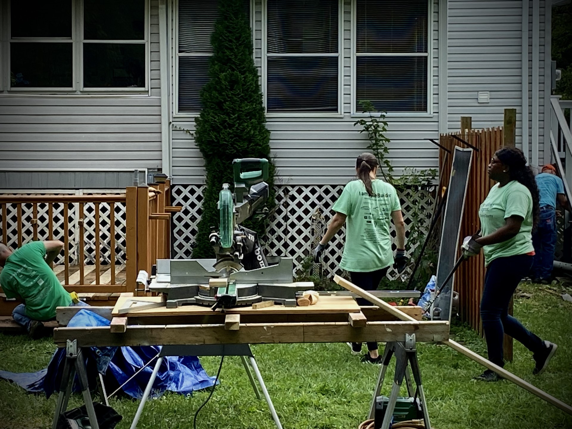 Volunteers working on projects at Gloria's home.