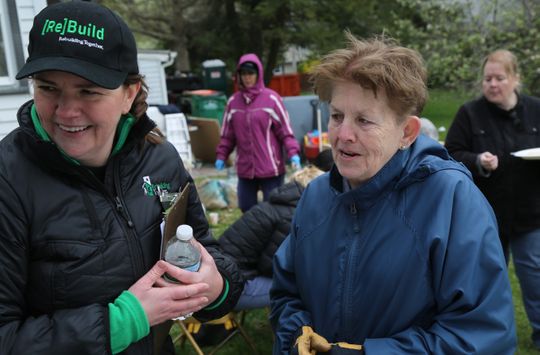 Rebuilding Together Dutchess County executive director Christina Boryk and homeowner Lee Baker