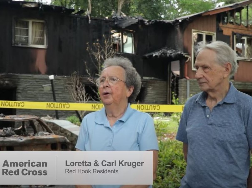 Carl and Loretta Kruger in front of their burnt home